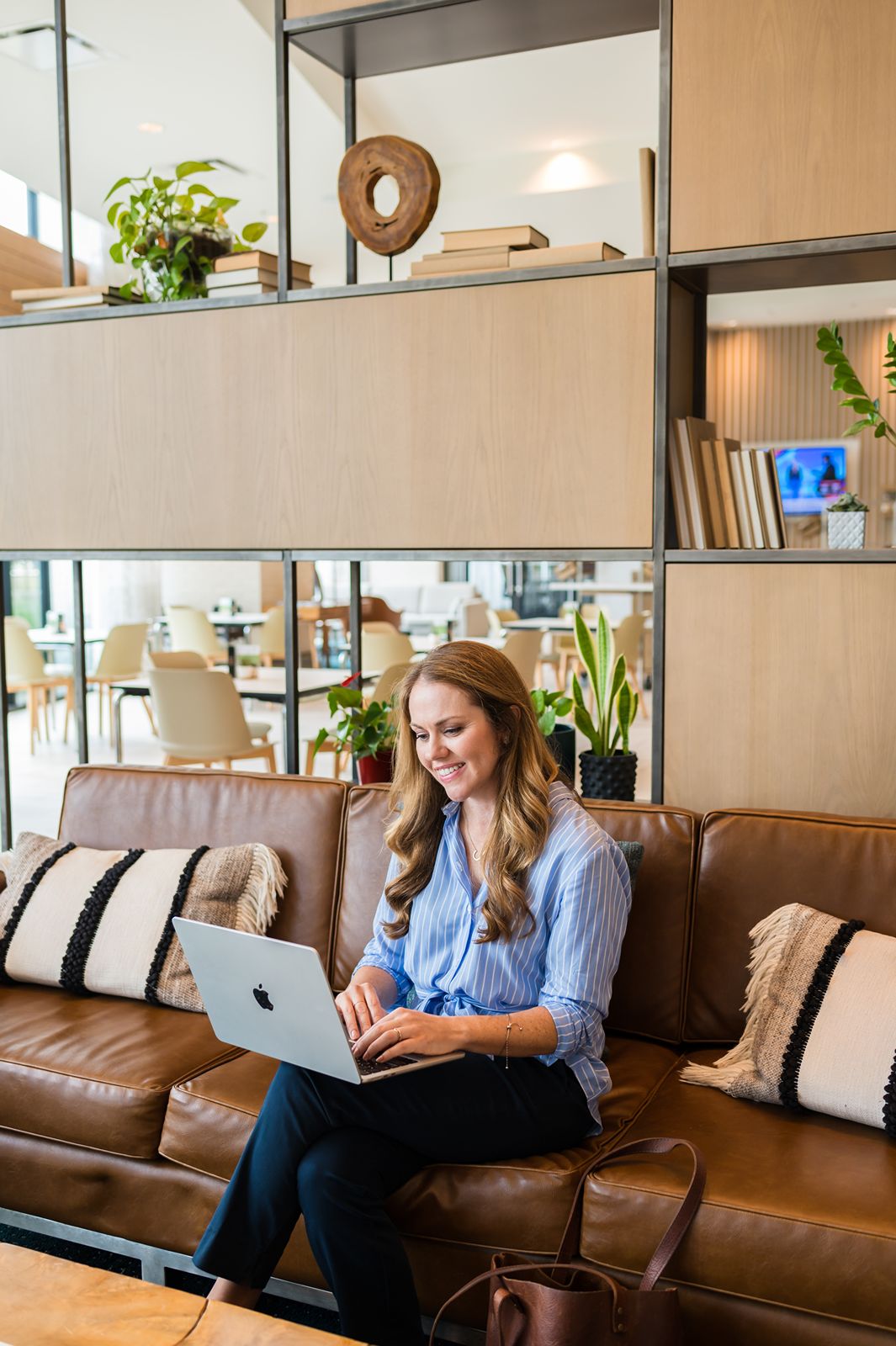 Jessica Ringer working on her laptop to create a SEO plan for a client